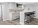 Basement bar with a modern design, quartz countertop, and seating for four at 801 S Harrison St, Denver, CO 80209