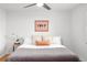 Cozy bedroom with a plush bed, artwork, and a ceiling fan at 801 S Harrison St, Denver, CO 80209