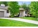 Beautiful house with painted brick exterior, well-manicured lawn, and inviting curb appeal at 801 S Harrison St, Denver, CO 80209