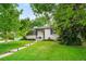 Classic one-story home with brick exterior, landscaped front yard, and a welcoming walkway at 801 S Harrison St, Denver, CO 80209