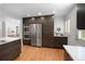 Open kitchen with modern appliances and hardwood floors at 801 S Harrison St, Denver, CO 80209