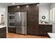 Kitchen view features stainless steel appliances and pantry space at 801 S Harrison St, Denver, CO 80209