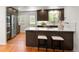 Modern kitchen with island, stainless steel appliances, and sleek finishes at 801 S Harrison St, Denver, CO 80209