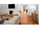 Living room featuring hardwood floors, fireplace and access to other rooms at 801 S Harrison St, Denver, CO 80209