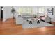 Bright living room featuring hardwood floors, large windows, and stylish modern furniture at 801 S Harrison St, Denver, CO 80209