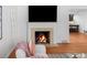 Cozy living room features a fireplace, hardwood floors, and stylish decor at 801 S Harrison St, Denver, CO 80209