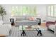 Cozy living room with bright hardwood floors and access to the kitchen and dining room at 801 S Harrison St, Denver, CO 80209