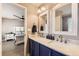 Modern bathroom with double vanity and a view of bedroom at 10246 Tall Oaks Cir, Parker, CO 80134