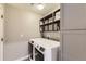 Bright laundry room with washer, dryer, and ample shelving at 10246 Tall Oaks Cir, Parker, CO 80134