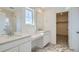 Modern bathroom with double vanity, marble floors, and glass-enclosed shower at 28644 E 7Th Ave, Watkins, CO 80137