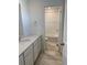 Bathroom featuring stylish vanity and tiled floors, as well as a toilet and tiled shower at 28644 E 7Th Ave, Watkins, CO 80137