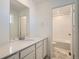 Clean bathroom featuring a white vanity and tiled shower-tub combo at 28644 E 7Th Ave, Watkins, CO 80137