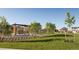 Community park featuring a pergola, green space and common gathering spaces at 28644 E 7Th Ave, Watkins, CO 80137