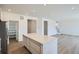 Modern kitchen featuring a center island with stone countertops at 28644 E 7Th Ave, Watkins, CO 80137