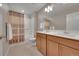 Bathroom with double sinks, vanity, shower, and a tub at 7465 E 157Th Pl, Thornton, CO 80602