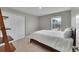 Bedroom featuring carpet, window and closet at 7465 E 157Th Pl, Thornton, CO 80602