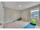 Carpeted exercise room with fitness equipment and natural light at 7465 E 157Th Pl, Thornton, CO 80602