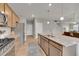 Kitchen features stainless steel appliances, granite counters and kitchen island at 7465 E 157Th Pl, Thornton, CO 80602