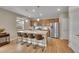 Modern kitchen with granite counters, stainless steel appliances, and pendant lighting at 7465 E 157Th Pl, Thornton, CO 80602