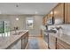 Close-up of the kitchen island featuring granite counters and stainless steel appliances at 7465 E 157Th Pl, Thornton, CO 80602