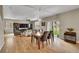 Open living area with hardwood floors and sliding glass doors at 7465 E 157Th Pl, Thornton, CO 80602
