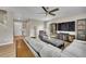 Spacious living room with ceiling fan and natural light at 7465 E 157Th Pl, Thornton, CO 80602