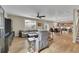 Open living area with hardwood floors leading to kitchen at 7465 E 157Th Pl, Thornton, CO 80602