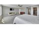 This spacious main bedroom has soft carpet, a sofa, walk-in closet, and a television at 7465 E 157Th Pl, Thornton, CO 80602