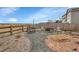 Backyard featuring a fire pit area, chairs, and a fenced perimeter for privacy at 9868 Olathe St, Commerce City, CO 80022