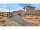 Backyard featuring a fire pit area, chairs, and a fenced perimeter for privacy at 9868 Olathe St, Commerce City, CO 80022