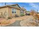 The home has a backyard with a patio area, grill, and well-manicured plants at 9868 Olathe St, Commerce City, CO 80022