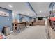 Finished basement with a dining area, bar, and a rec room with a sectional at 9868 Olathe St, Commerce City, CO 80022
