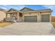 Charming ranch-style home featuring a covered front porch and a two-car garage at 9868 Olathe St, Commerce City, CO 80022