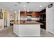 Spacious kitchen island with stainless steel appliances and views into the home at 9868 Olathe St, Commerce City, CO 80022
