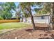 Landscaped backyard features lush grass, a patio area, and mature trees at 1226 W 98Th Ave, Northglenn, CO 80260