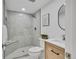 Modern bathroom featuring a walk-in shower, vanity with sink, and tile accents at 1226 W 98Th Ave, Northglenn, CO 80260