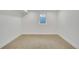 A minimalist bedroom with a small window letting in light at 1226 W 98Th Ave, Northglenn, CO 80260