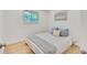 Cozy bedroom with hardwood floors, natural light, and a comfortable bed at 1226 W 98Th Ave, Northglenn, CO 80260