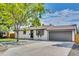 Charming single-story home featuring a well-maintained lawn and a two-car attached garage at 1226 W 98Th Ave, Northglenn, CO 80260