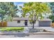 Charming single story home with grey painted brick and well-manicured front yard at 1226 W 98Th Ave, Northglenn, CO 80260