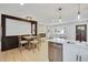 Open-concept living space combining dining and living areas with modern finishes and plenty of natural light at 1226 W 98Th Ave, Northglenn, CO 80260