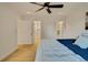 Bright main bedroom featuring hardwood floors, ceiling fan, and ensuite bathroom at 1226 W 98Th Ave, Northglenn, CO 80260