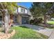 Charming two-story home features a well-manicured lawn and stone accents at 2215 E 103Rd Pl, Thornton, CO 80229