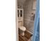 Cozy half bathroom with modern fixtures, stylish accents, and a wood-look plank floor at 2215 E 103Rd Pl, Thornton, CO 80229