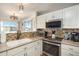 Bright and functional kitchen with updated appliances and countertops at 2215 E 103Rd Pl, Thornton, CO 80229