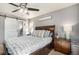 Spacious main bedroom with a barn door leading to the en-suite bathroom at 2215 E 103Rd Pl, Thornton, CO 80229