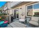 Private deck with wooden furniture, grill, sliding door to home and small blue accent table at 2215 E 103Rd Pl, Thornton, CO 80229