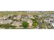 Aerial view of townhome community featuring well-maintained lawns and convenient attached garages at 23456 E 5Th Pl # 104, Aurora, CO 80018