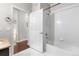 Bathroom view showing the tub and an open door to the hallway at 23456 E 5Th Pl # 104, Aurora, CO 80018