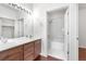 Bathroom featuring double sinks, generous vanity and framed mirror at 23456 E 5Th Pl # 104, Aurora, CO 80018
